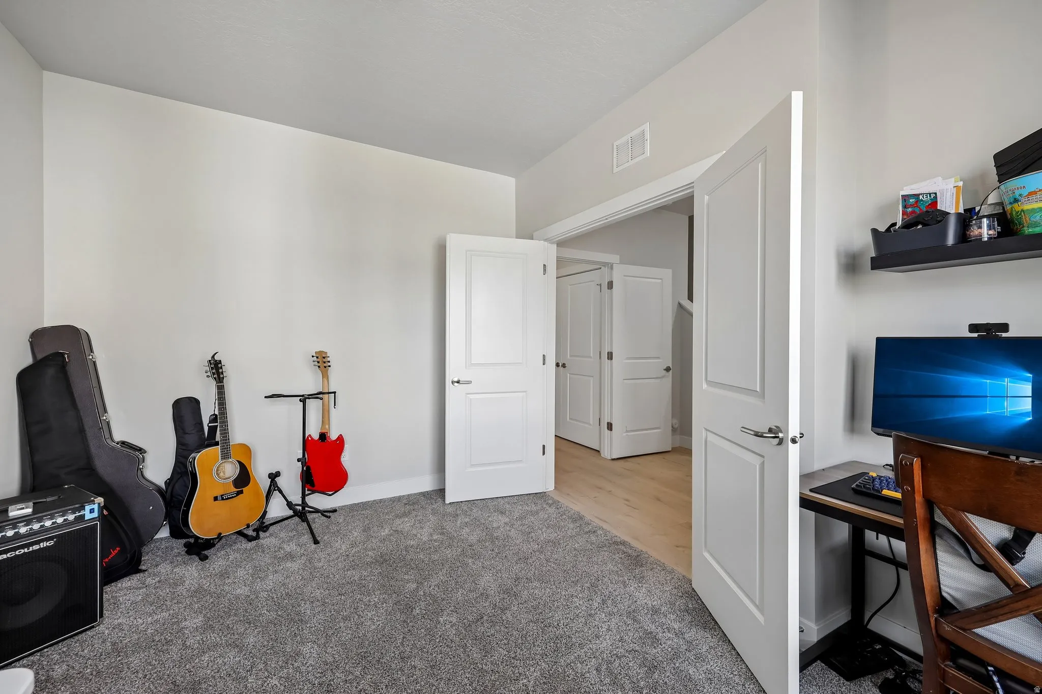 Game room featuring light colored carpet and baseboards