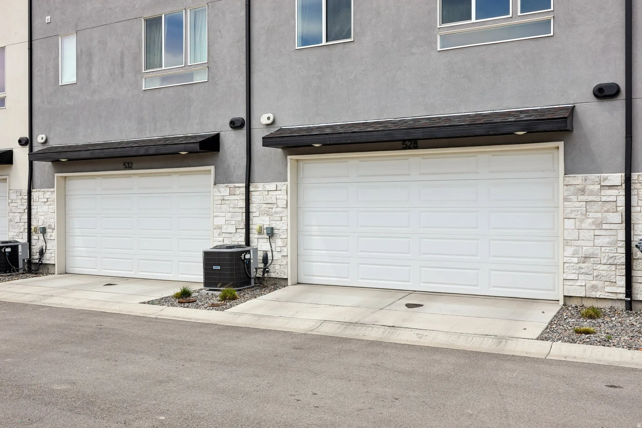 Garage featuring concrete driveway