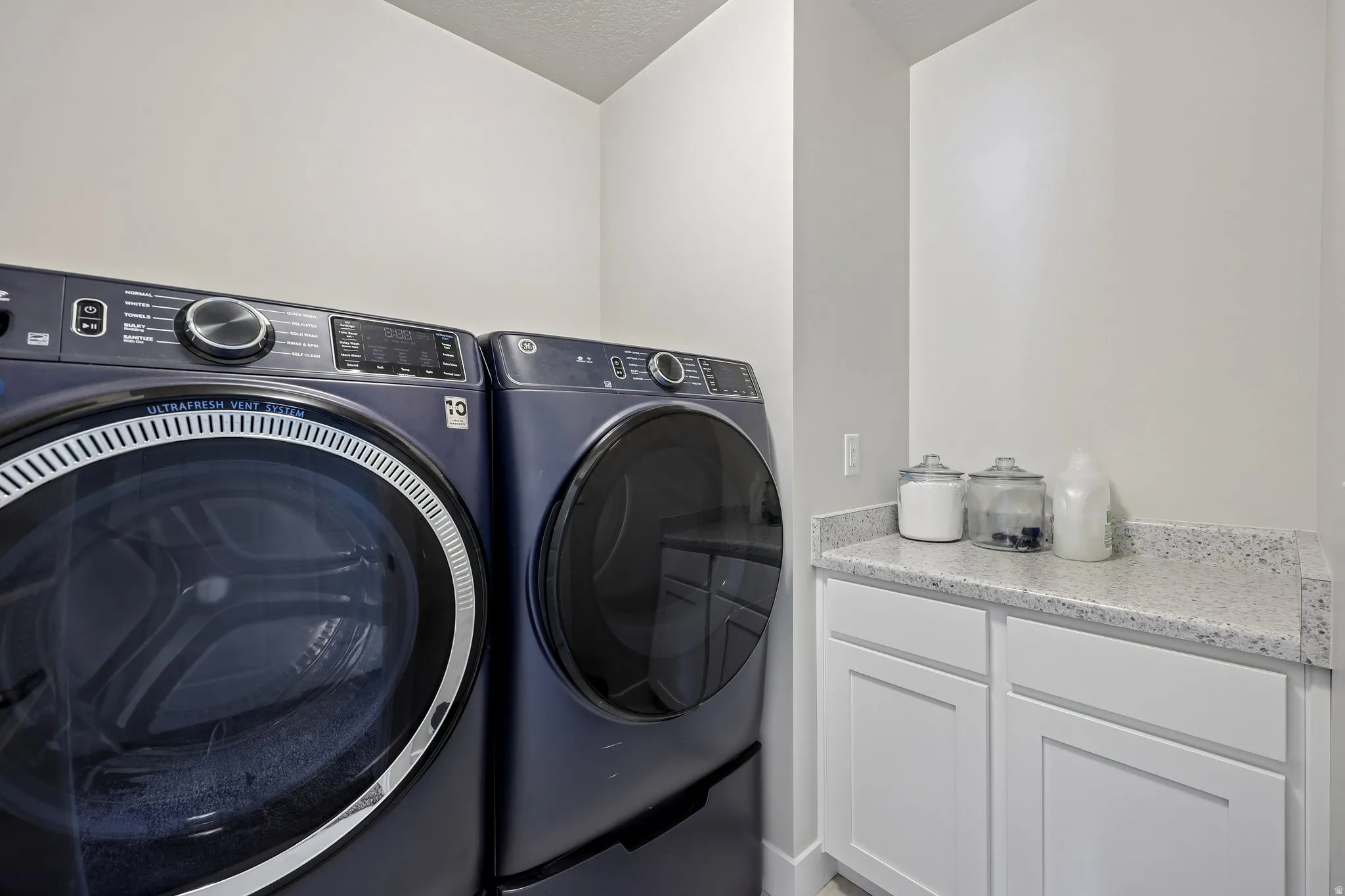 Laundry room featuring independent washer and dryer