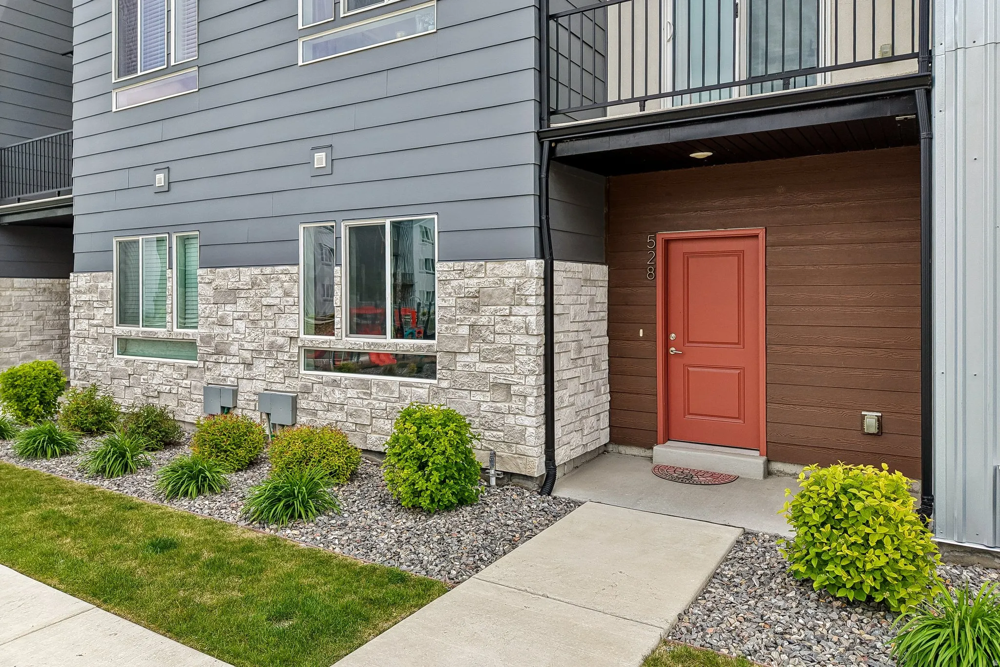 Property entrance with stone siding