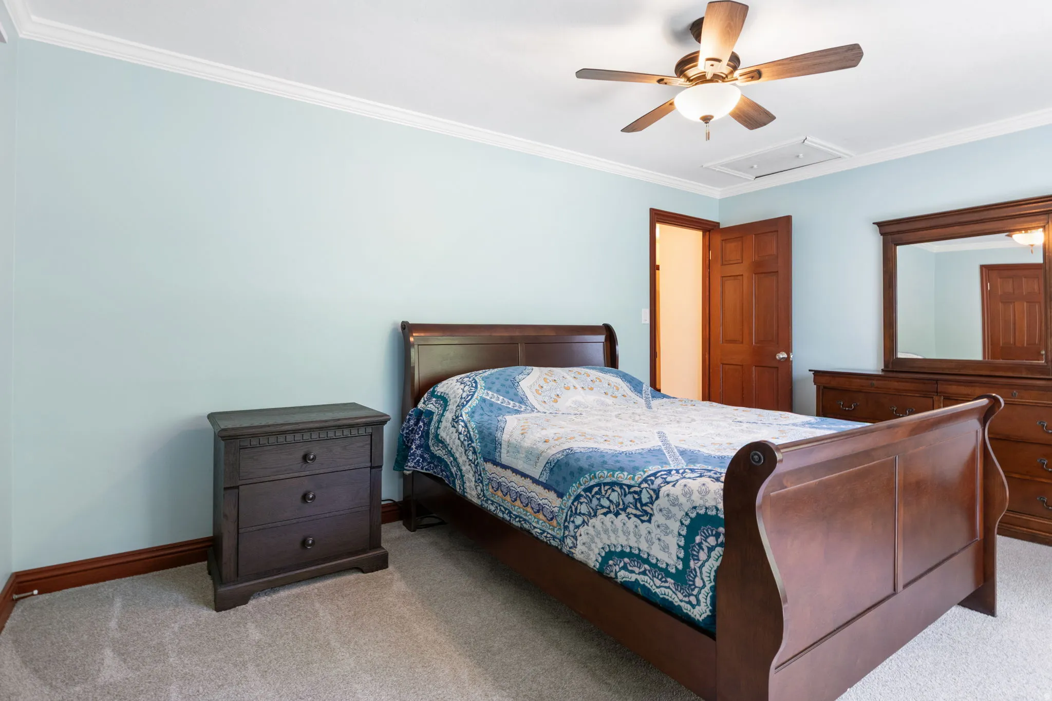 Bedroom 3 featuring light blue walls and crown molding