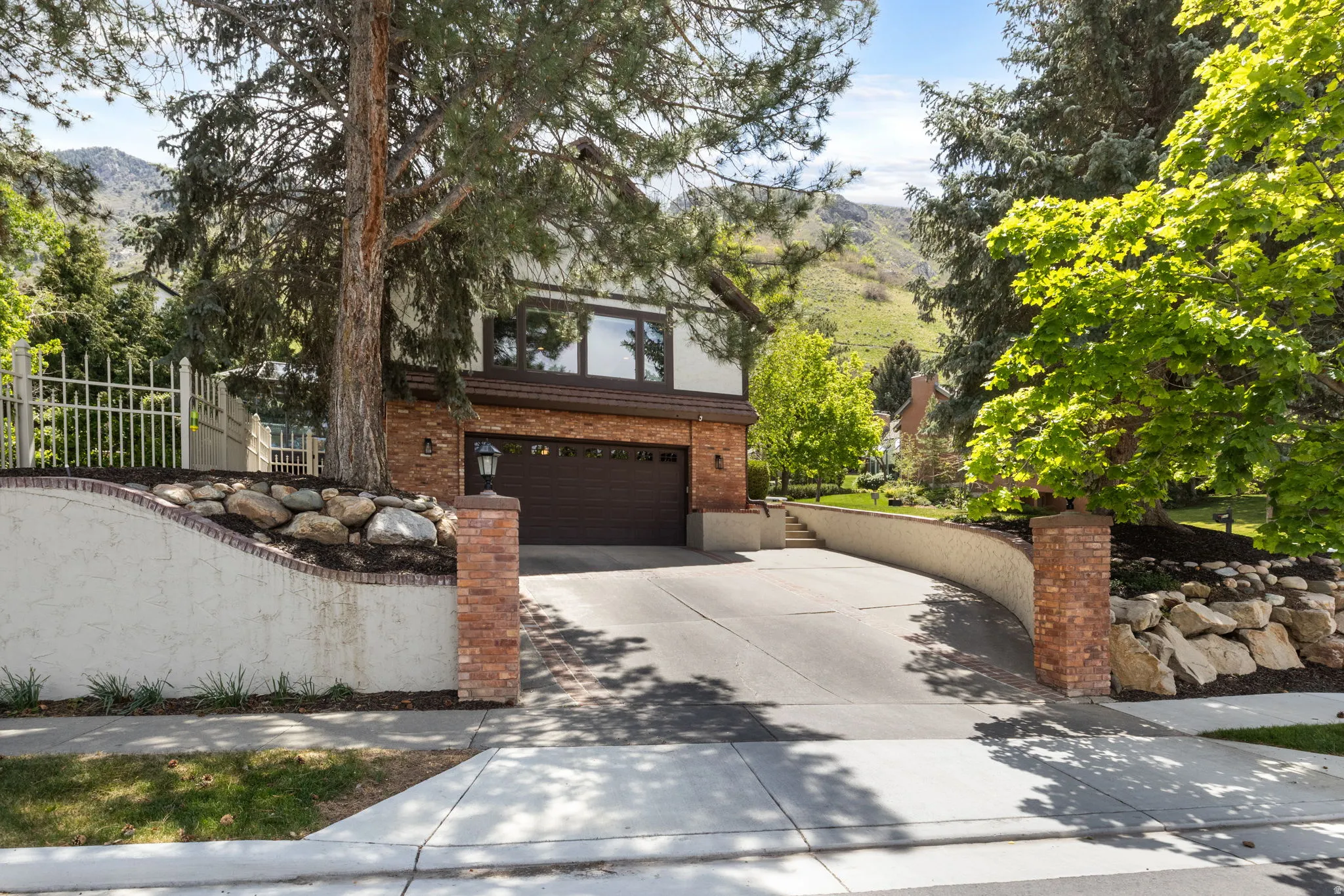 Brick and stucco facade home with a two-car garage