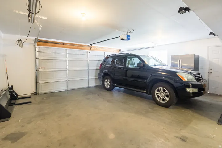 Attached garage with concrete flooring