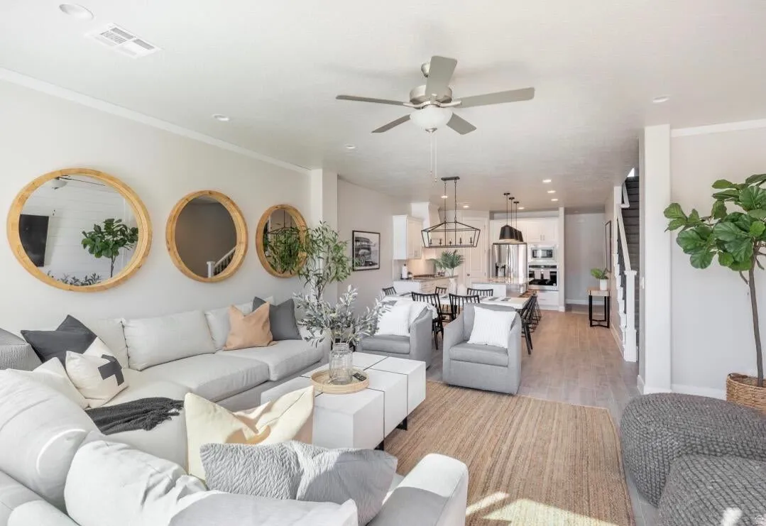 Open-concept living space featuring recessed lighting and wood-finish flooring