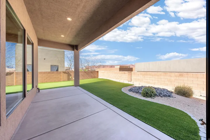 Covered concrete patio with recessed lighting