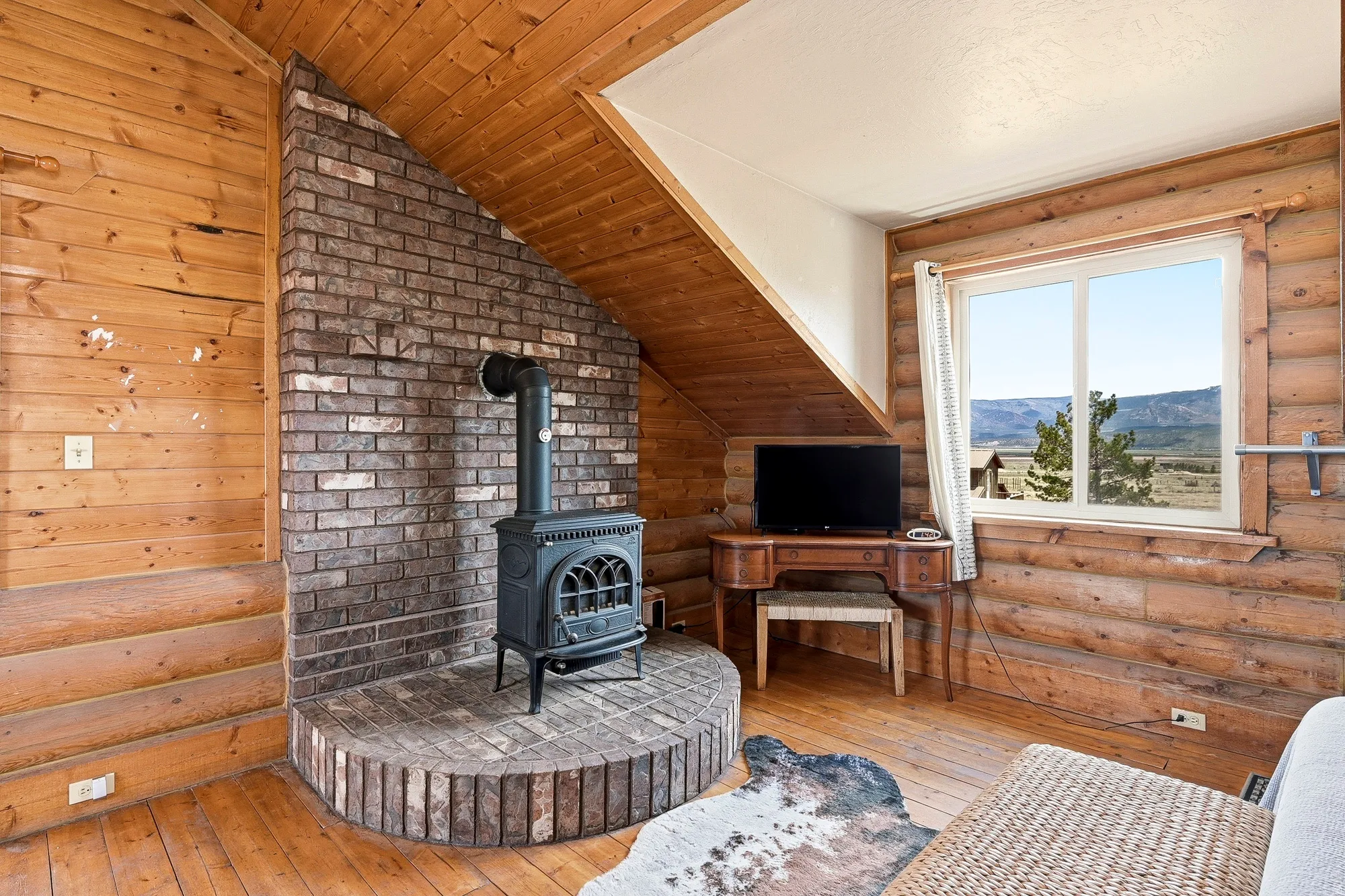 Interior space featuring wood-finish walls and sloped ceiling