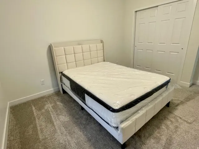 Plush neutral carpeting complements light-colored walls