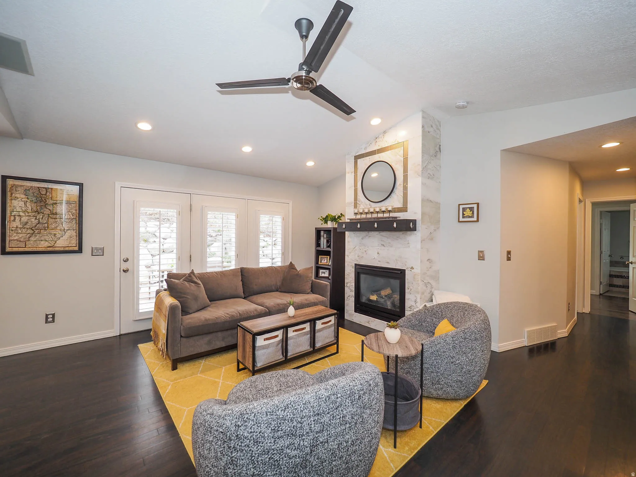 Stunning, Cozy Great Room/Family Room with Newer Marble Fireplace Facade, Awesome Vaulted Ceilings, Recessed Lighting, Stylish Contemporary Ceiling Fan & More!