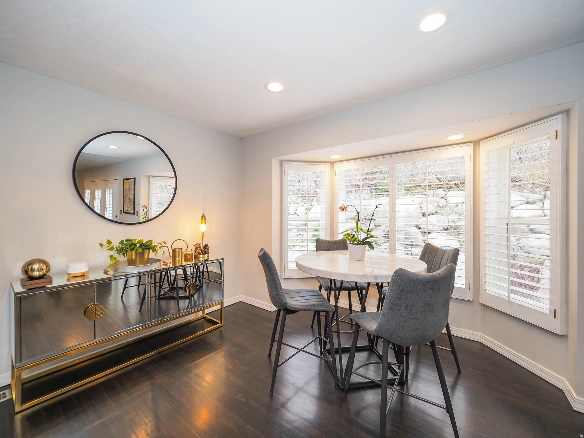 Lovely, Spacious Semi-Formal Dining Featuring Beautiful Wood-Finish Flooring, Recessed Lighting, & Lovely Bay Window with Plantation Shutters!