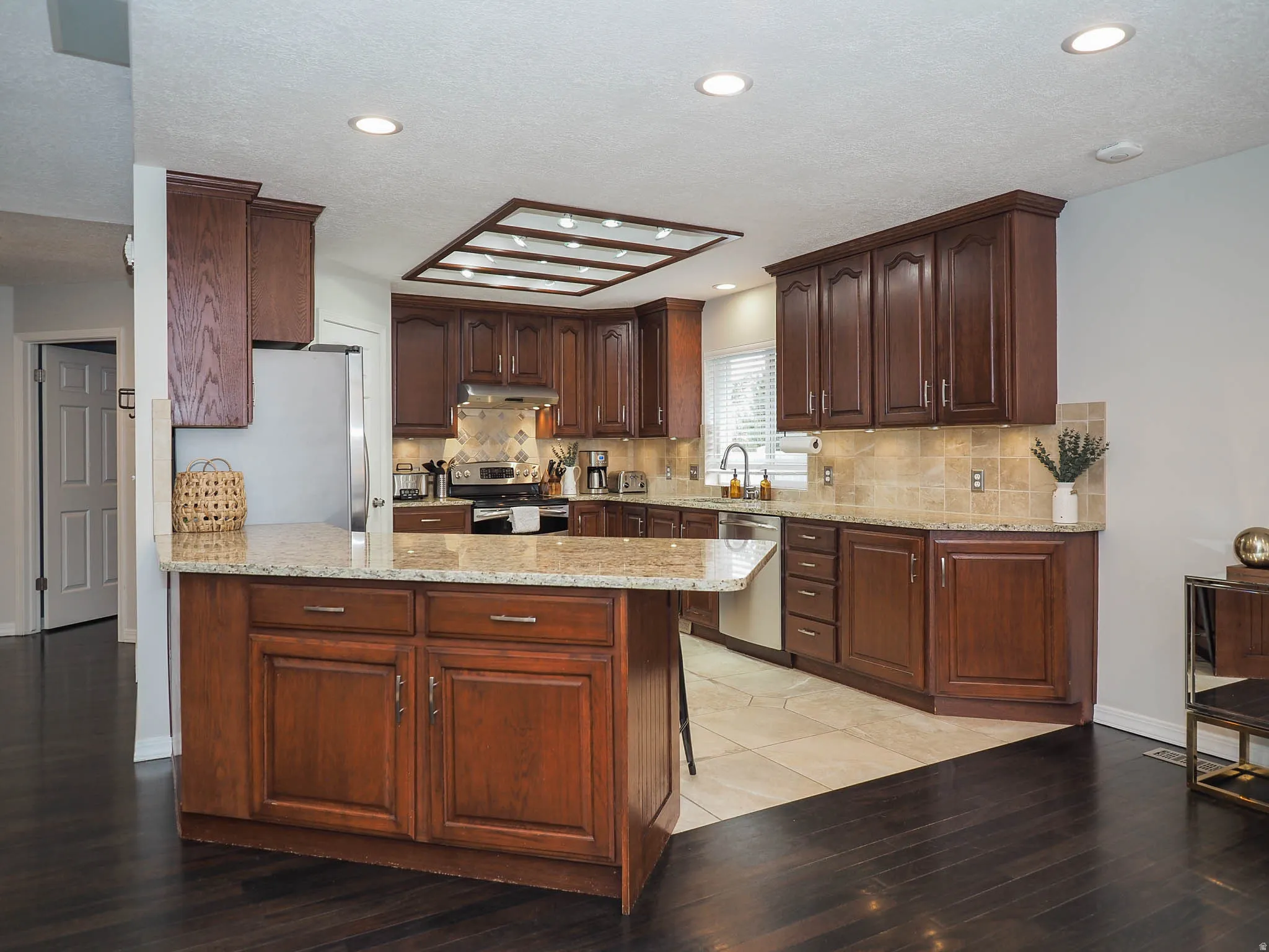 Spacious Kitchen with Beautiful Granite Countertops, Cherrywood Cabinets, Double Ovens, Butler's Pantry, Stainless Steel Appliances, Tap On/Tap Off Faucet & More, Plus, the Refrigerator, Range & Microwave are Included!