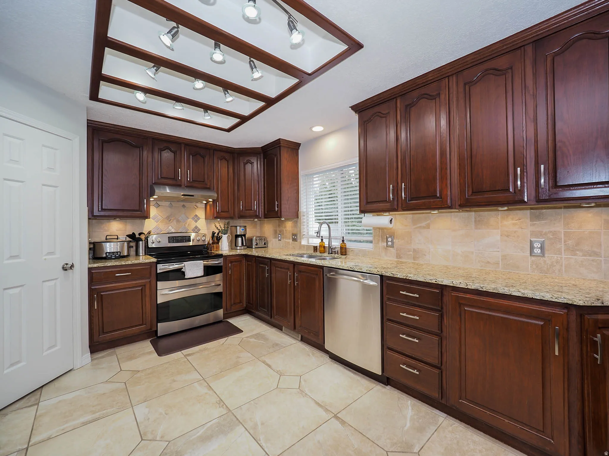 Spacious Kitchen with Beautiful Granite Countertops, Cherrywood Cabinets, Double Ovens, Butler's Pantry, Stainless Steel Appliances, Tap On/Tap Off Faucet & More, Plus, the Refrigerator, Range & Microwave are Included!