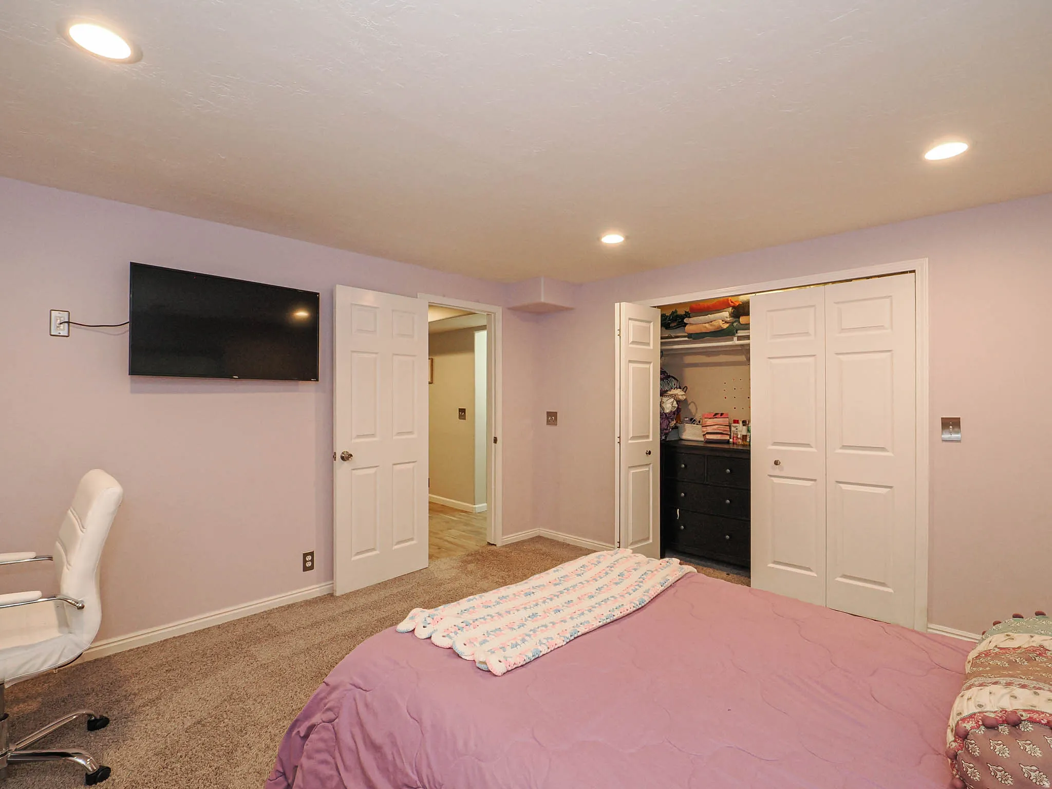 Spacious 4th Bedroom with Recessed Lighting Featuring Plush Carpet Flooring, a Window with Blinds, and Soft Relaxing Wall Tones.