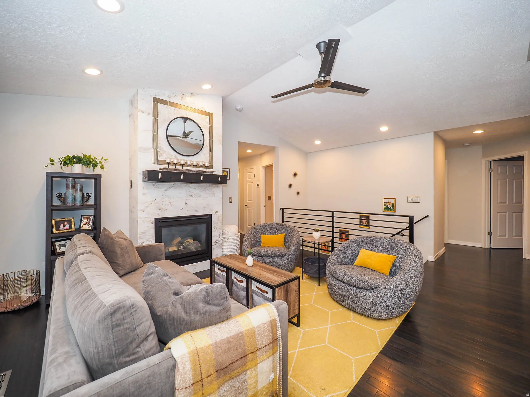 Stunning, Cozy Great Room/Family Room with Newer Marble Fireplace Facade, Awesome Vaulted Ceilings, Recessed Lighting, Stylish Contemporary Ceiling Fan & More!