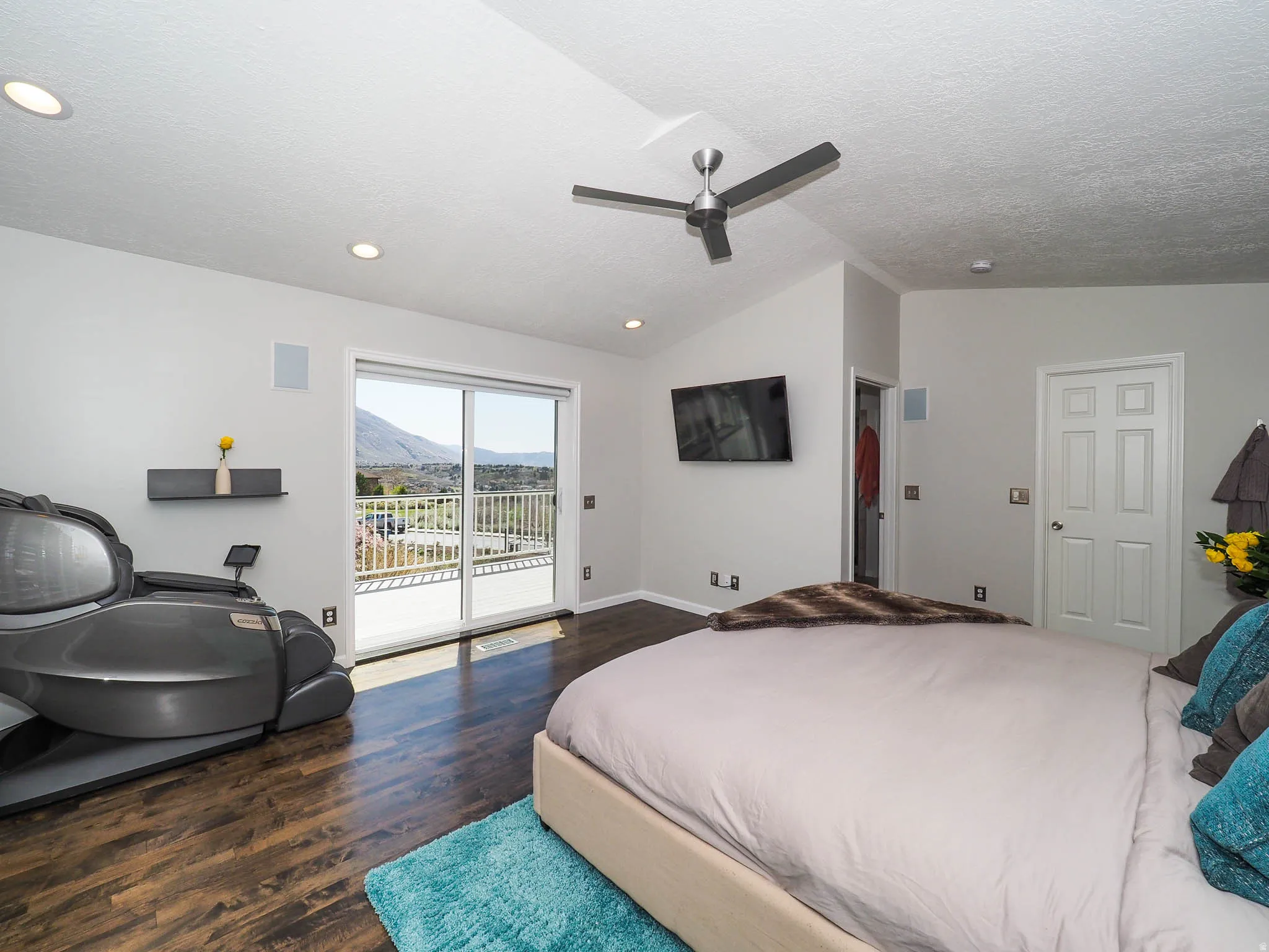 Large, Private Primary En Suite with Expansive Vaulted Ceiling, Modern Newer Ceiling Fan, Wonderful Newer Patio Door with Newer Remote Controlled Electronic Shade Offering a Seamless Connection to Romantic Outdoor Spaces from Your Beautiful Newer Deck!