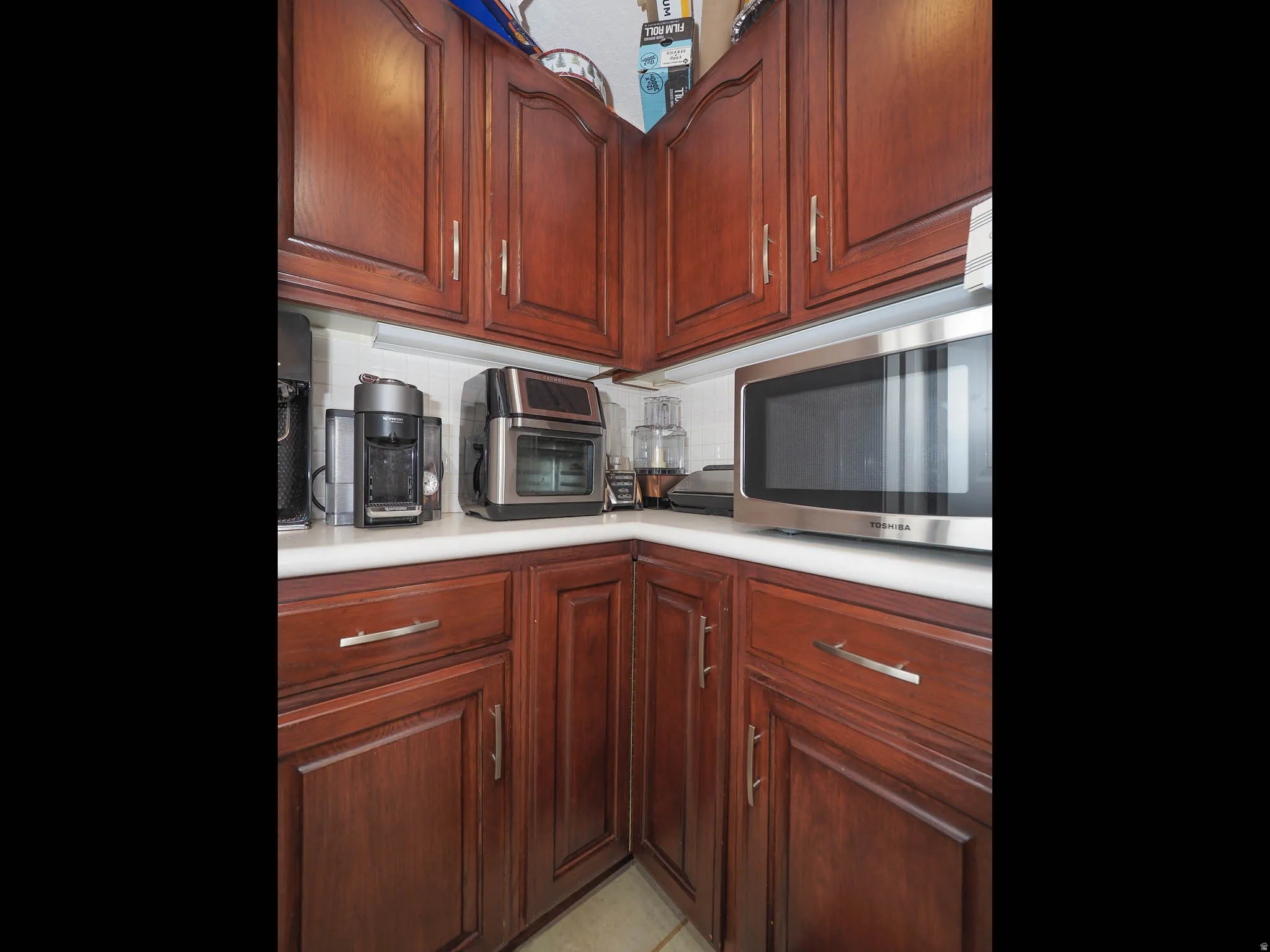 Spacious Kitchen with Beautiful Granite Countertops, Cherrywood Cabinets, Double Ovens, Butler's Pantry, Stainless Steel Appliances, Tap On/Tap Off Faucet & More, Plus, the Refrigerator, Range & Microwave are Included!