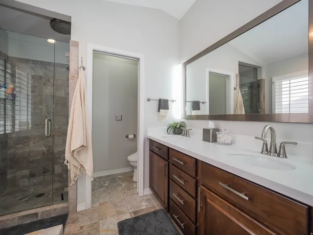 Primary En Suite Sanctuary with Relaxing Jetted Tub, Lovely Glass Enclosed Separate Shower, Newer Luxurious Bidet Feature, Convenient Double Sinks, Lush Newer Silestone Countertop, Attractive Newer Mirror, LED Lights & More!