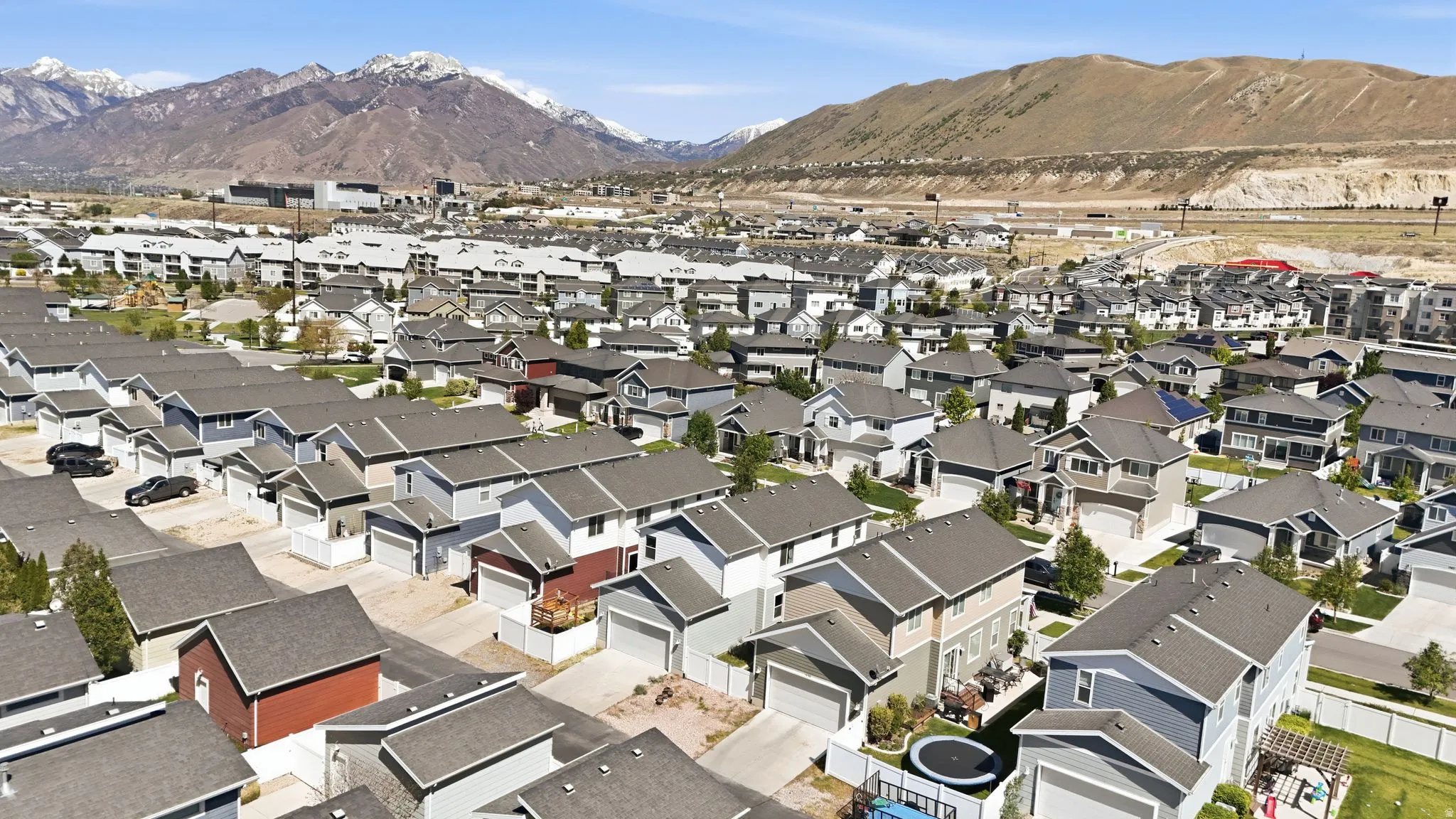 Expansive residential development featuring numerous single-family homes with diverse exterior finishes