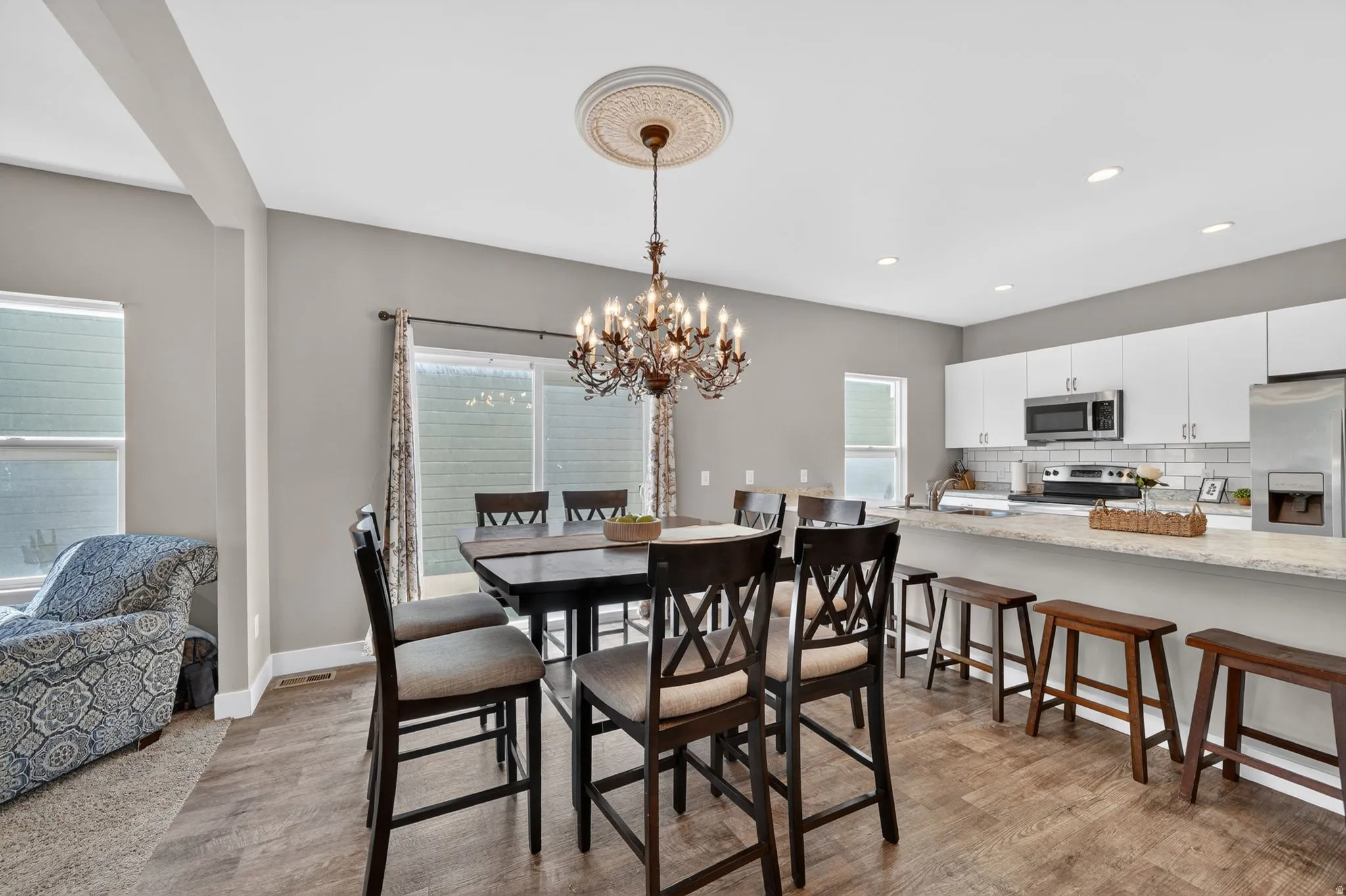Open-concept living space featuring wood-finish flooring throughout