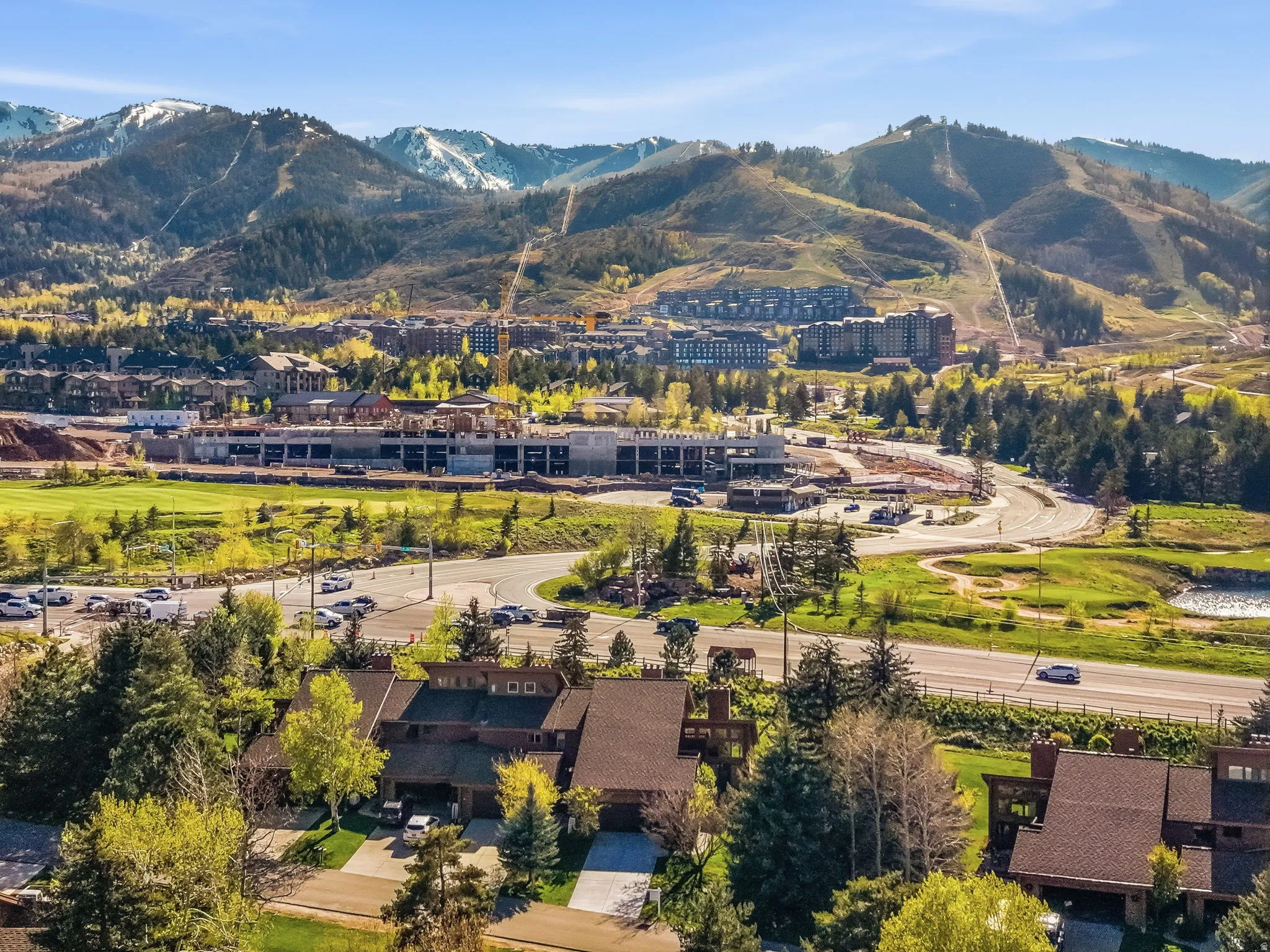 Residential properties featuring pitched roofs and mature landscaping