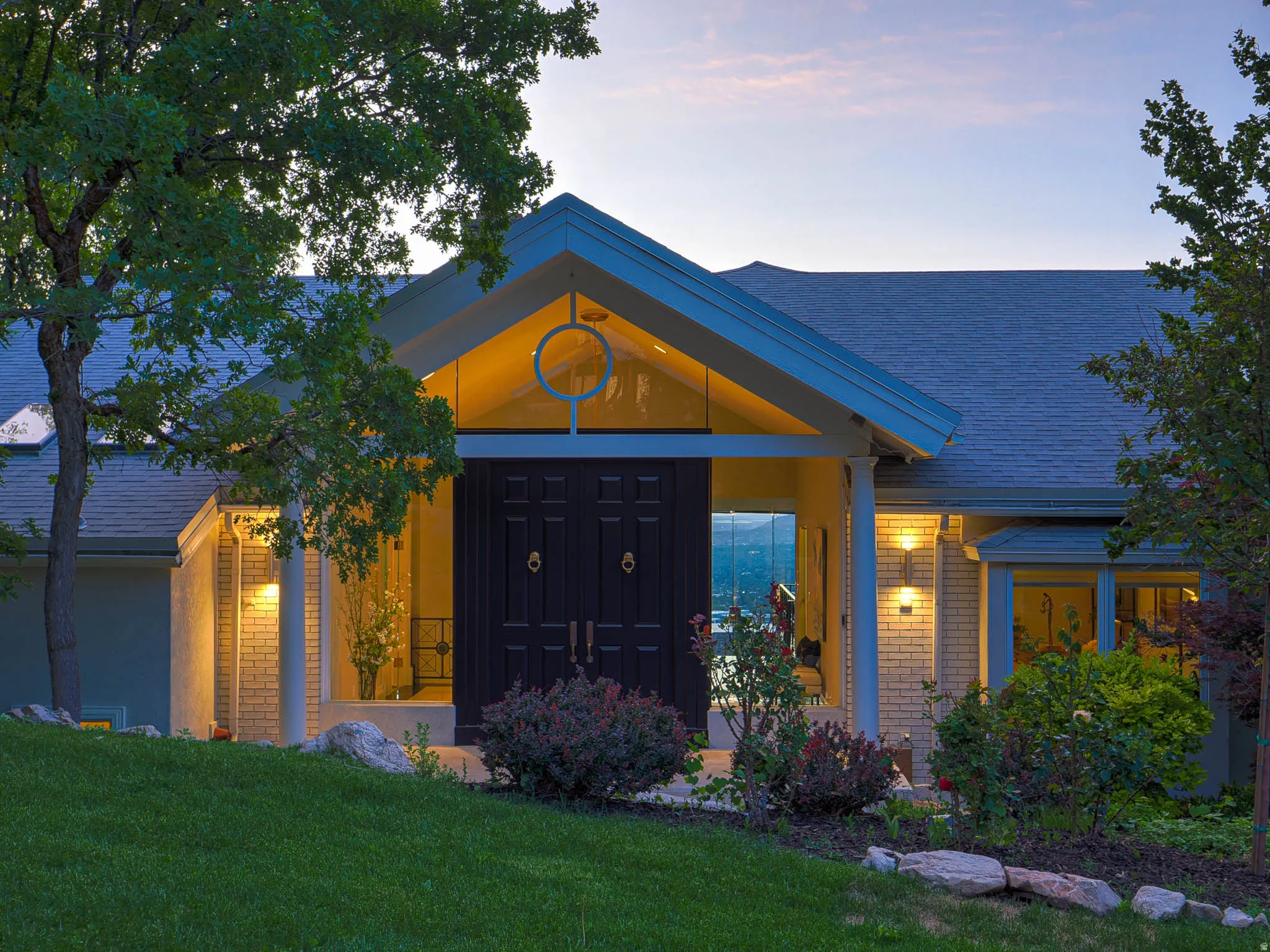 Architectural entry with double doors and transom window