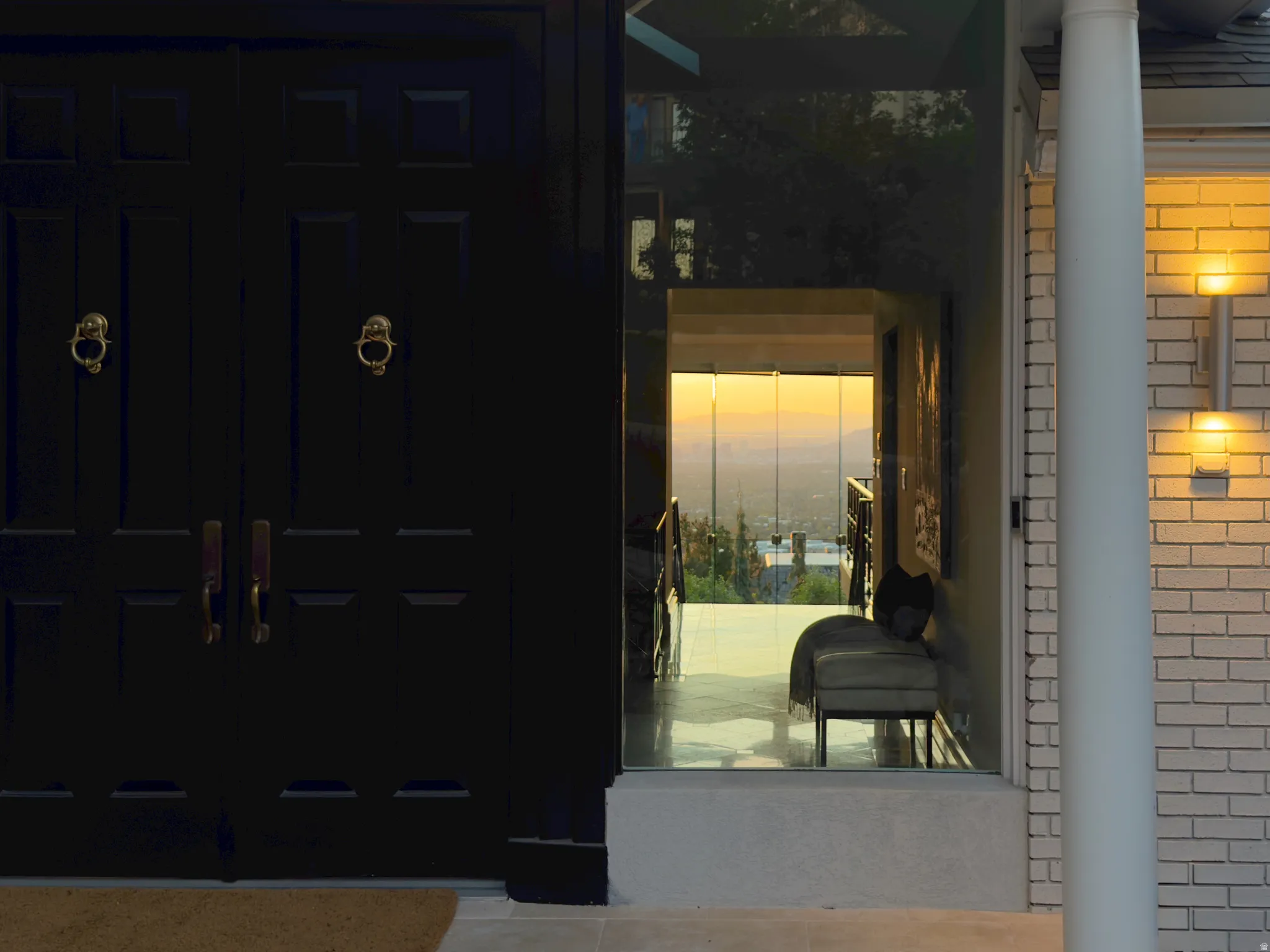 Grand double entry doors with decorative brass knockers