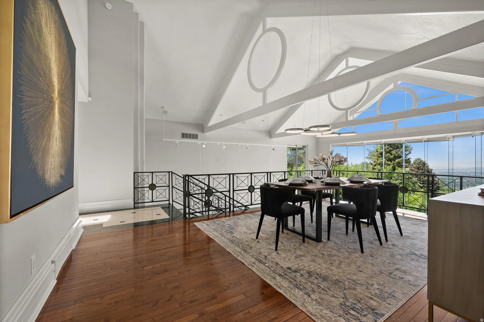 Vaulted ceilings with exposed beams and architectural windows
