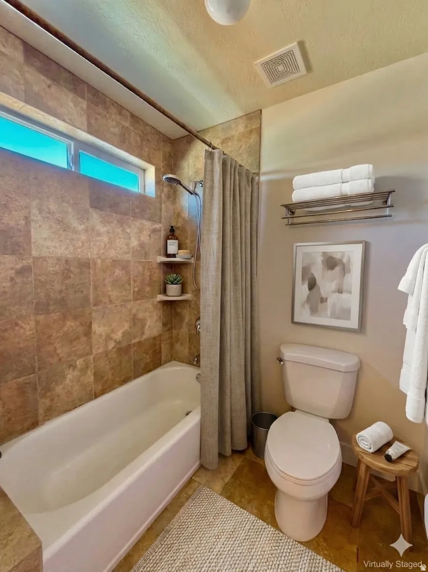 Full bathroom featuring a shower / bath combo