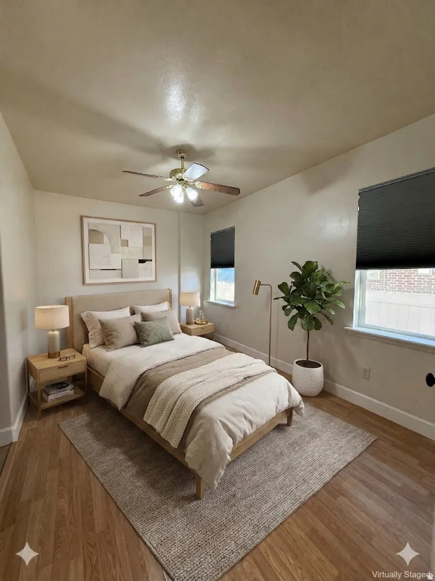 Bedroom featuring wood finished floors and a ceiling fan