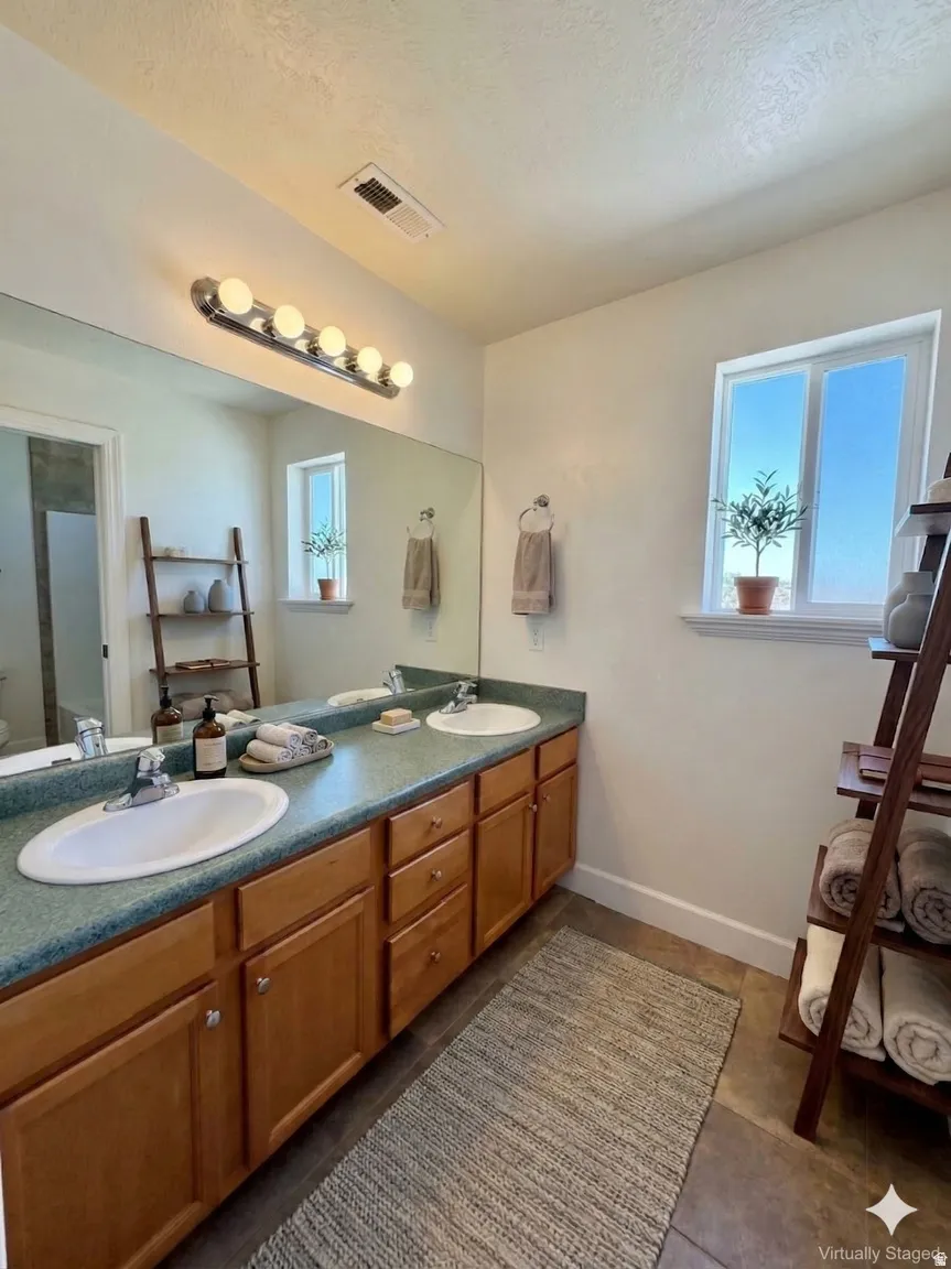 Full bathroom featuring double vanity
