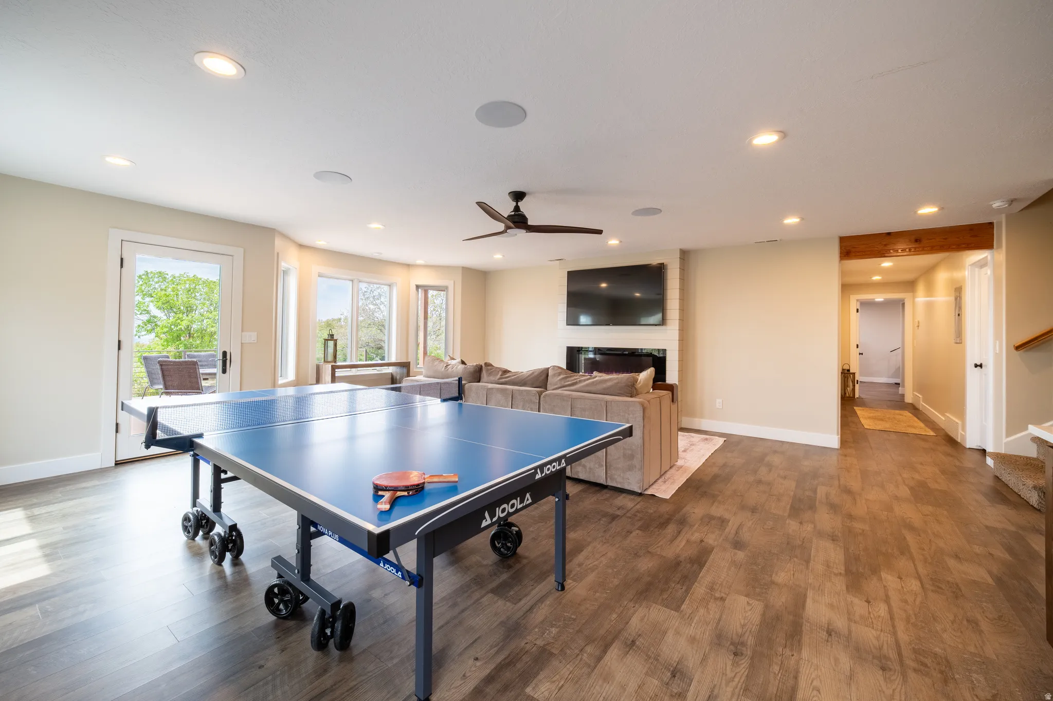 Downstairs family room with walkout to lower deck and lawn