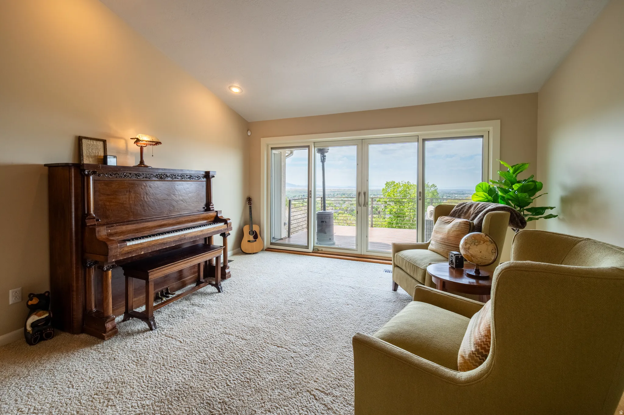 Formal living/music room off entry with double sliding doors onto deck