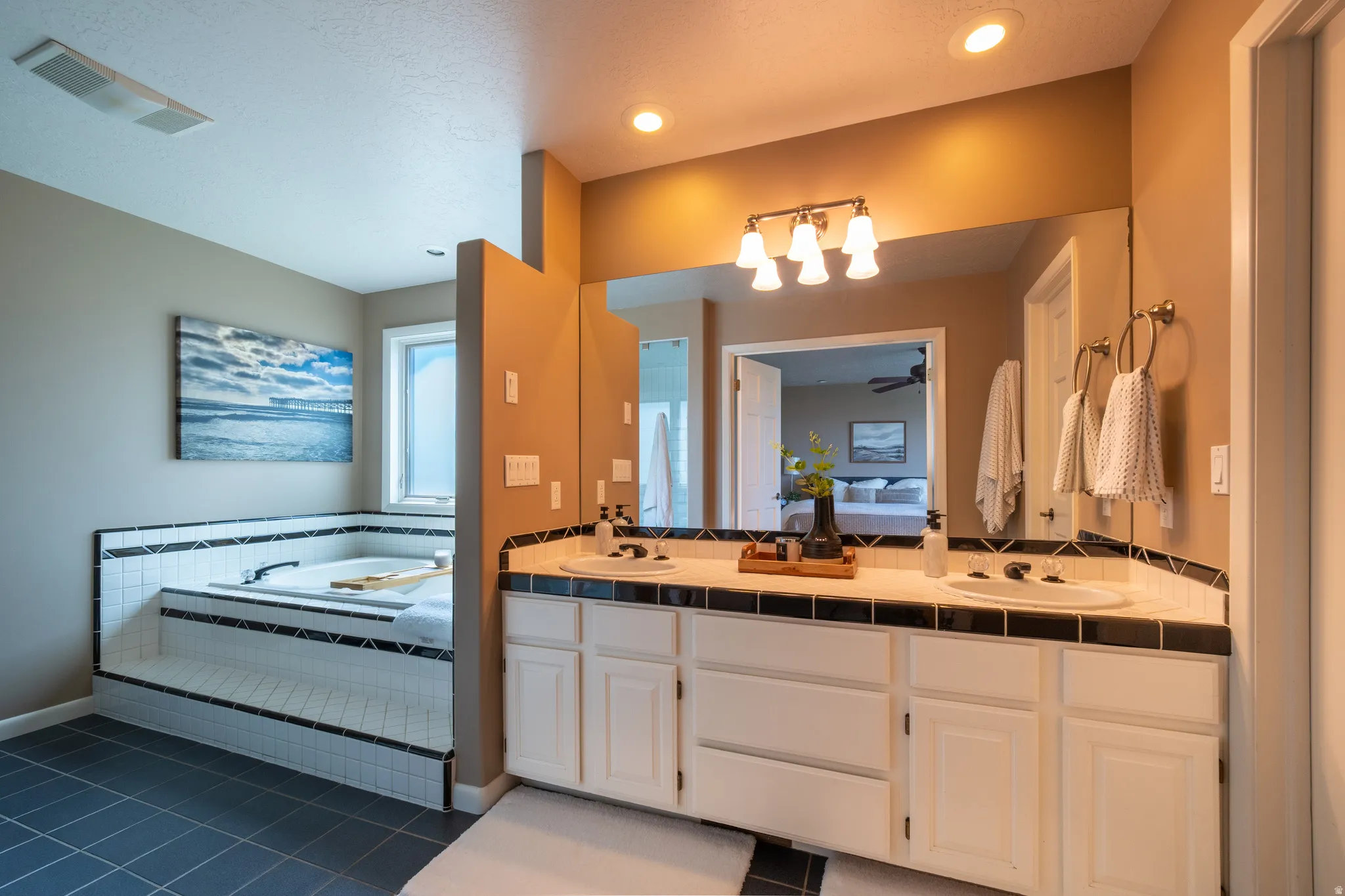 Dual vanity with integrated sinks, ample countertop space, and under-cabinet storage