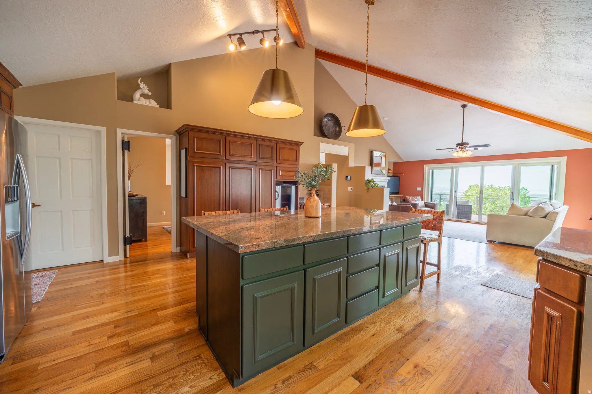 large kitchen with vaulted ceilings, real hardwood floors
