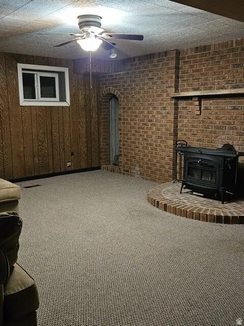 Brick wall with integrated wood-burning stove and a semicircular brick hearth