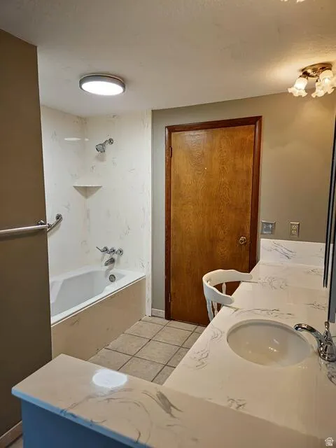 Bathroom vanity featuring a single integrated sink with chrome faucet