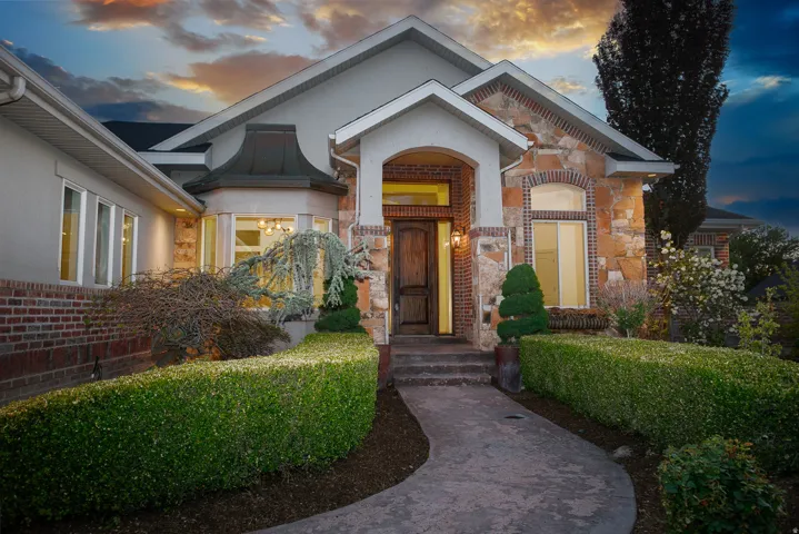 Stone and brick facade with an arched entry