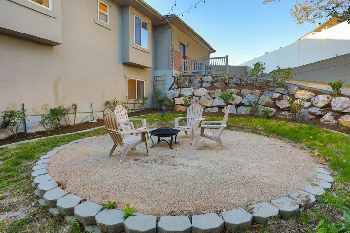 Circular gravel patio featuring concrete border blocks