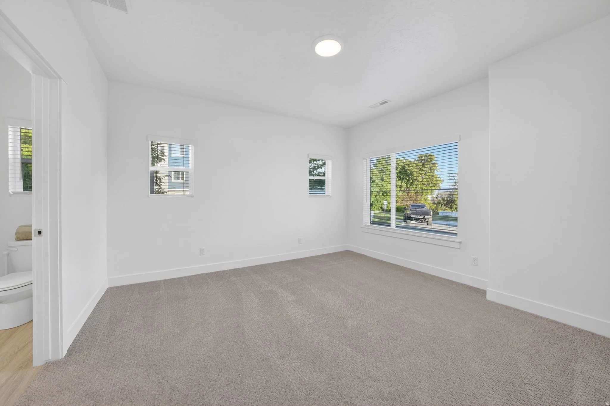 Spacious Main floor primary suite. Multiple windows, incredible natural light, Ensuite Bathroom, Walk-in closet