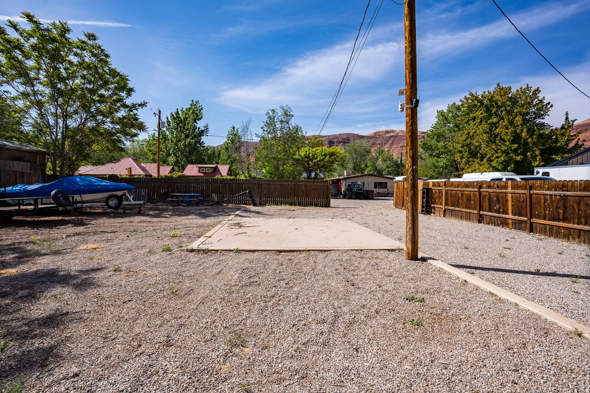 Fenced backyard featuring a mountain view