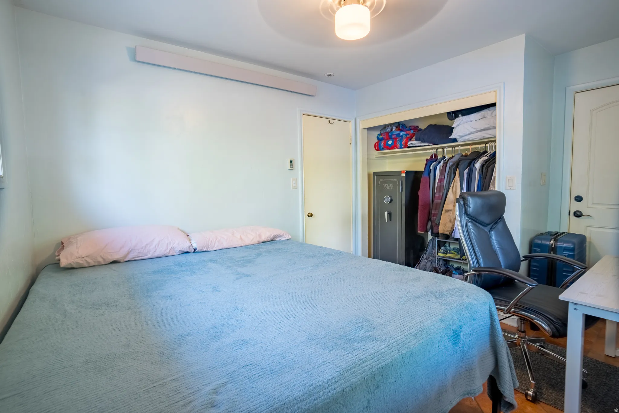 Bedroom with a closet and a ceiling fan