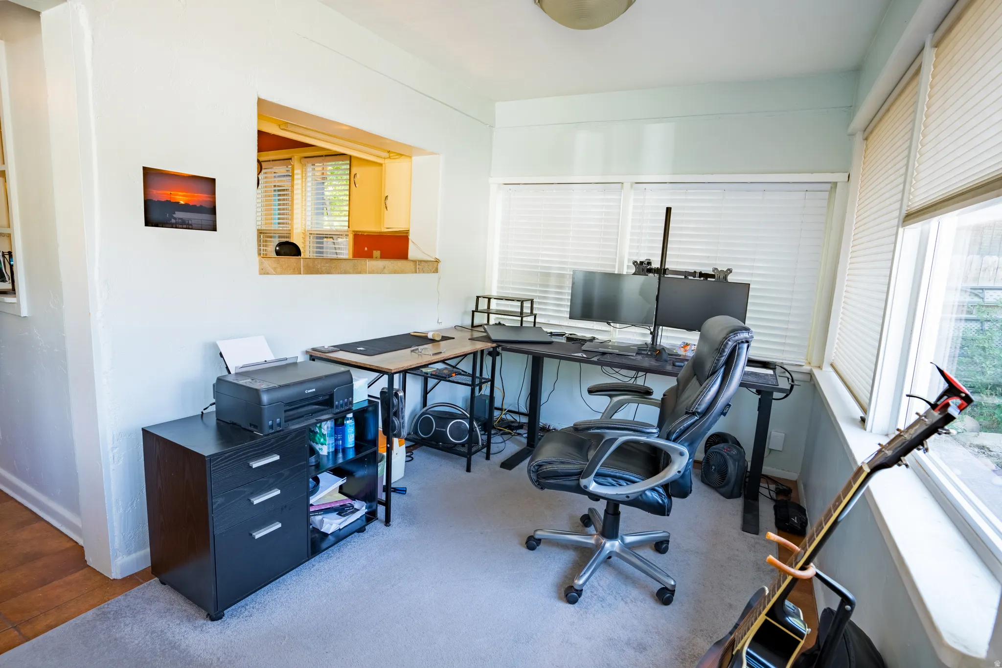 Carpeted office with baseboards