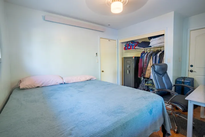 Bedroom with a closet and a ceiling fan