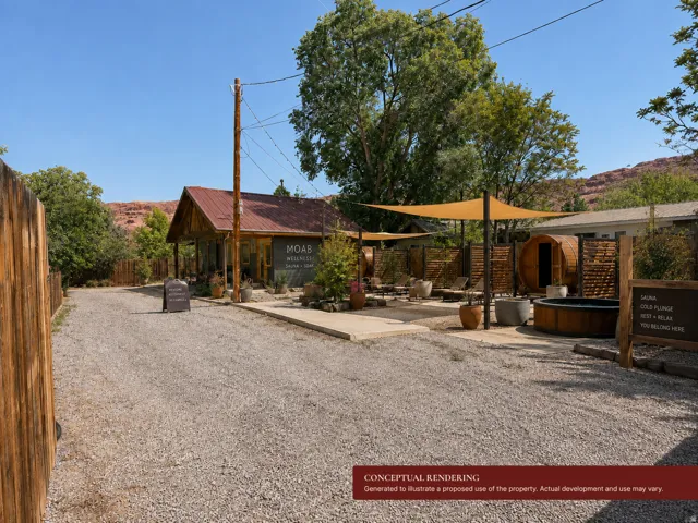 Gravel parking area, rustic-style building with a metal roof, outdoor shaded seating, barrel sauna, and a cold plunge pool