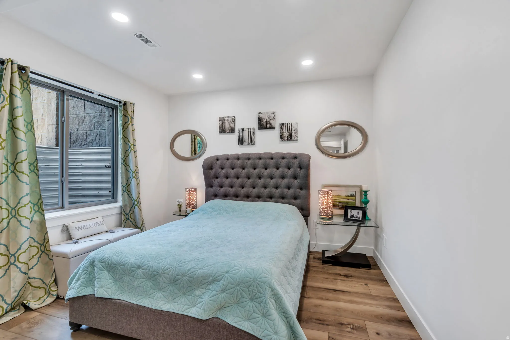 Bedroom featuring wood-finish flooring and recessed lighting