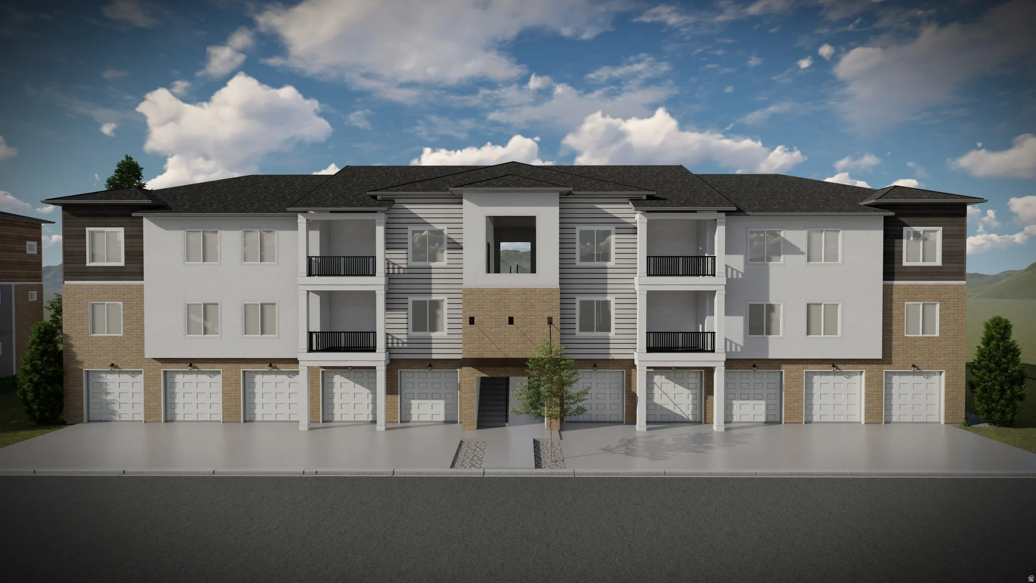 Multi-level residential building featuring a dark shingle roof, light-colored siding, and brick accents