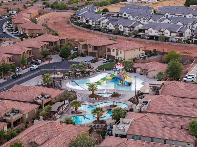 Aerial perspective of suburban area featuring a pool area