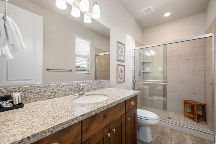 Full bath with vanity and a stall shower