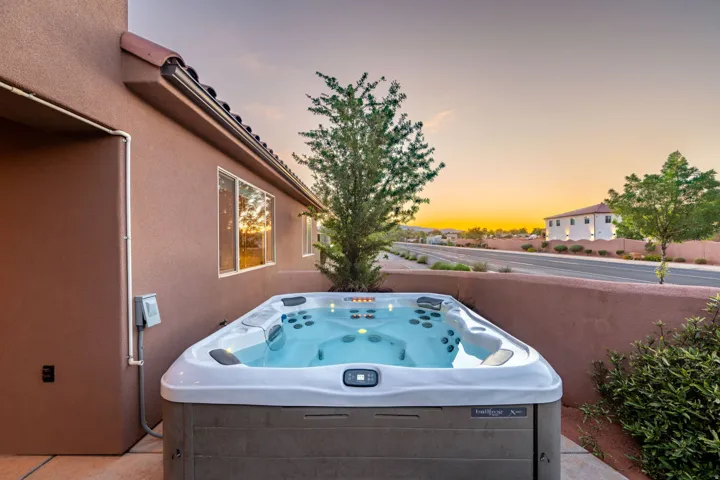 Patio terrace at dusk with a hot tub