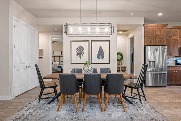 Dining space with light wood-style floors and recessed lighting