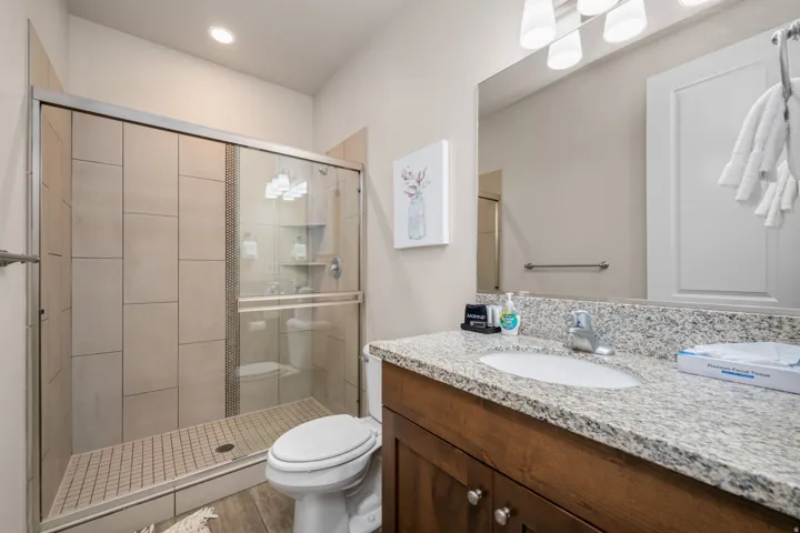 Bathroom featuring vanity and a stall shower